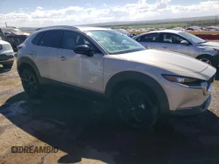 2022 Mazda CX-30 2.5 Turbo with VIN 3MVDMBAY1NM447753, listed as a Copart auction lot 68148334 with 5,180 mi miles and Salvage Title. Bid and sale history available at DreamBid. Image 4.