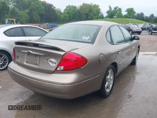 2002 Ford Taurus SES Standard with VIN 1FAFP55S42A248753, listed as a IAAI auction lot 42112264 with 219,560 mi miles. Bid and sale history available at carsss.com. Image 4.
