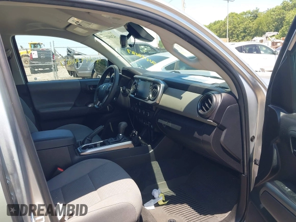 2023 Toyota Tacoma SR with VIN 3TYCZ5AN2PT141576, listed as a IAAI auction lot 42492127 with 43,431 mi miles and . Bid and sale history available at DreamBid. Image 5.