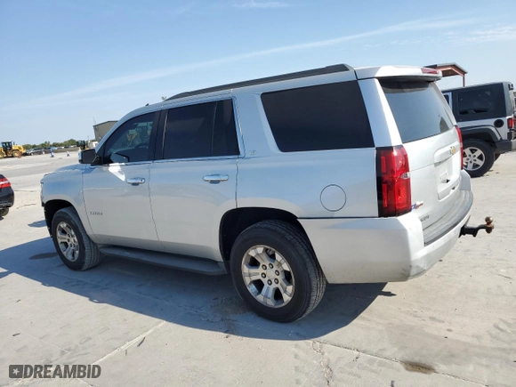 2015 Chevrolet Tahoe LS with VIN 1GNSKAKC3FR245127, listed as a Copart auction lot 74401204 with 160,179 mi miles and Salvage Title. Bid and sale history available at carsss.com. Image 2.