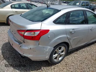 2014 Ford Focus SE with VIN 1FADP3F28EL162669, listed as a IAAI auction lot 42128555 with 104,265 mi miles and . Bid and sale history available at carsss.com. Image 6.