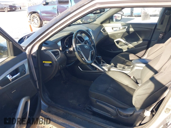 2017 Hyundai Veloster with VIN KMHTC6AD9HU323472, listed as a IAAI auction lot 41865974 with 94,692 mi miles. Bid and sale history available at carsss.com. Image 5.