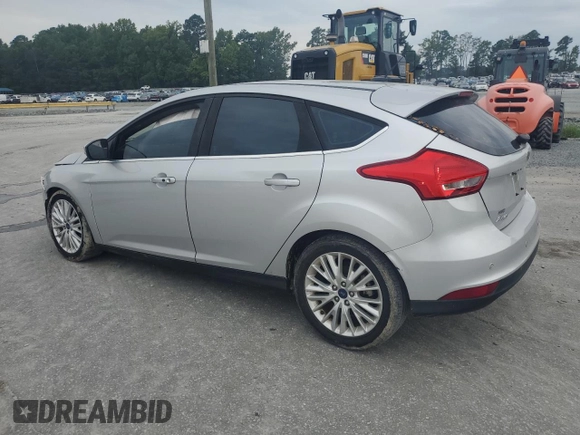 2017 Ford Focus Titanium with VIN 1FADP3N27HL251297, listed as a Copart auction lot 67373094 with 104,733 mi miles and Salvage Title. Bid and sale history available at carsss.com. Image 2.