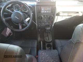 2009 Jeep Wrangler Rubicon with VIN 1J8GA64159L700909, listed as a Copart auction lot 86308954 with 138,065 mi miles and Salvage title. Bid and sale history available at DreamBid. Image 8.