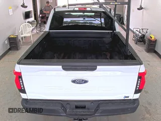 2022 Ford F-150 Lightning Pro with VIN 1FTVW1EL5NWG11725, listed as a IAAI auction lot 42832825 with 5,044 mi miles and . Bid and sale history available at DreamBid. Image 12.