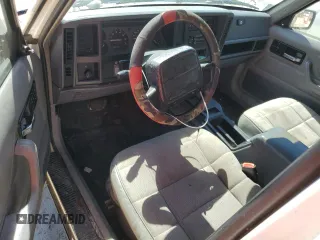 1996 Jeep Cherokee Sport with VIN 1J4FT68S4TL131956, listed as a Copart auction lot 74568064 with 174,014 mi miles and Non Repairable. Bid and sale history available at carsss.com. Image 8.