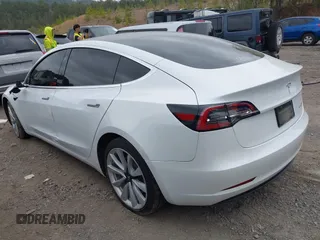 2020 Tesla Model 3 Long Range with VIN 5YJ3E1EB0LF703733, listed as a IAAI auction lot 41796732 with 75,027 mi miles. Bid and sale history available at carsss.com. Image 3.