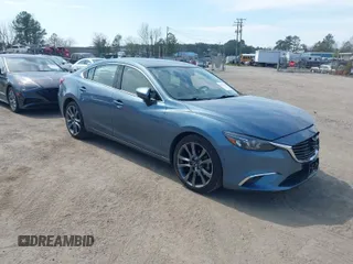 2016 Mazda Mazda6 i Grand Touring with VIN JM1GJ1W57G1459597, listed as a IAAI auction lot 41911786 with 103,240 mi miles. Bid and sale history available at carsss.com. Image 1.