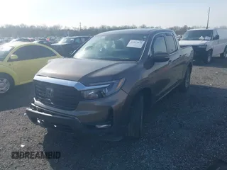 2022 Honda Ridgeline RTL z VIN 5FPYK3F51NB038239, wystawiony jako IAAI lot #41937070 z przebiegiem 39 012 mil mil oraz . Historia ofert i sprzedaży dostępna na DreamBid. Obrazek 2.