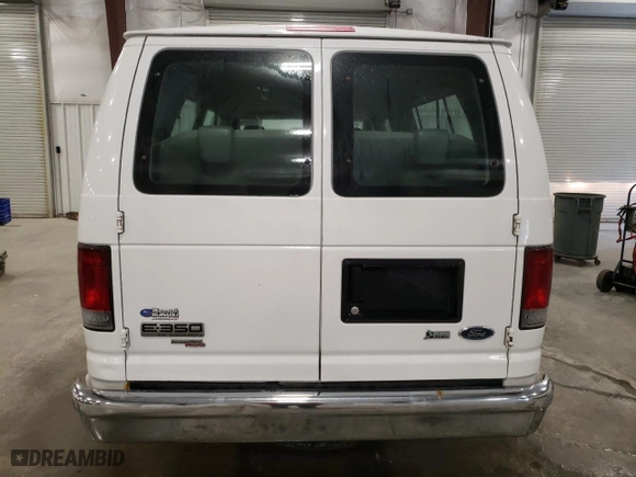 2010 Ford Econoline Wagon XL with VIN 1FBSS3BL8ADA62210, listed as a Copart auction lot 69939574 with 111,593 mi miles and Salvage Title. Bid and sale history available at carsss.com. Image 6.