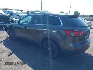 2015 Mazda CX-9 Grand Touring z VIN JM3TB3DV8F0465155, wystawiony jako IAAI lot #42366636 z przebiegiem 125 407 mil mil oraz . Historia ofert i sprzedaży dostępna na DreamBid. Obrazek 3.