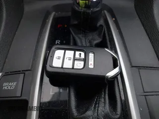 2018 Honda Civic EX with VIN 2HGFC2F71JH502564, listed as a IAAI auction lot 41933157 with 56,696 mi miles and . Bid and sale history available at DreamBid. Image 11.