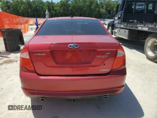 2012 Ford Fusion SE z VIN 3FAHP0HG0CR421694, wystawiony jako Copart lot #57179145 z przebiegiem 208 731 mil mil oraz Czysty tytuł • Clean title. Historia ofert i sprzedaży dostępna na DreamBid. Obrazek 6.