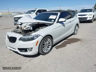 2015 BMW 2 Series 228i with VIN WBA1K5C50FV474011, listed as a IAAI auction lot 41805879 with 83,489 mi miles. Bid and sale history available at carsss.com. Image 2.