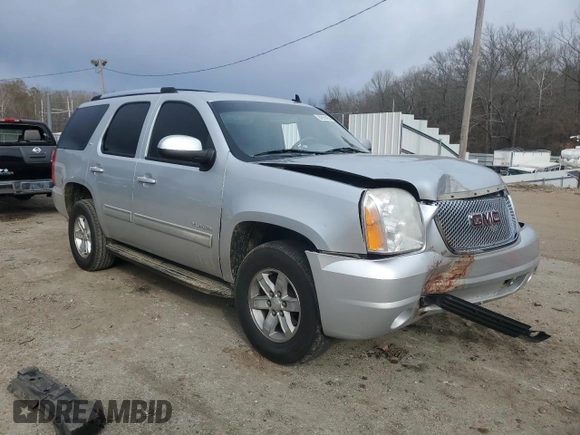 2012 GMC Yukon SLT with VIN 1GKS1CE08CR203822, listed as a Copart auction lot 82955253 with 122,508 mi miles and Salvage Title. Bid and sale history available at carsss.com. Image 4.