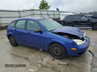 2005 Ford Focus S with VIN 3FAFP37N35R156460, listed as a Copart auction lot 58781635 with 231,066 mi miles and Salvage title. Bid and sale history available at DreamBid. Image 4.