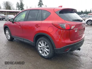 2015 Mazda CX-5 Grand Touring with VIN JM3KE4DY0F0479392, listed as a IAAI auction lot 41659415 with 141,403 mi miles. Bid and sale history available at carsss.com. Image 3.