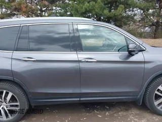 2017 Honda Pilot Touring with VIN 5FNYF6H92HB012090, listed as a IAAI auction lot 41882542 with 110,179 mi miles and . Bid and sale history available at DreamBid. Image 13.