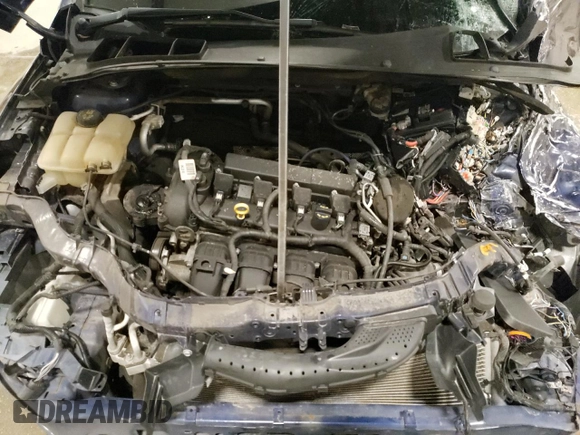 2016 Ford Focus Titanium z VIN 1FADP3J27GL310367, wystawiony jako Copart lot #55048005 z przebiegiem 86 676 mil mil oraz Szkoda całkowita • Salvage title. Historia ofert i sprzedaży dostępna na DreamBid. Obrazek 11.