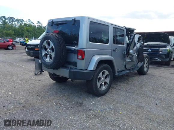 2016 Jeep Wrangler Unlimited Sahara with VIN 1C4BJWEG3GL240859, listed as a IAAI auction lot 42628937 with 103,378 mi miles and . Bid and sale history available at DreamBid. Image 4.