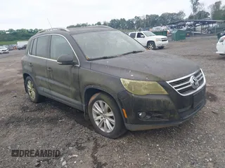 2009 Volkswagen Tiguan SE with VIN WVGBV75N29W520228, listed as a IAAI auction lot 42621508 with 106,686 mi miles and . Bid and sale history available at DreamBid. Image 1.