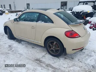 2019 Volkswagen Beetle S with VIN 3VWFD7AT1KM703684, listed as a IAAI auction lot 41571691 with 111,180 mi miles. Bid and sale history available at carsss.com. Image 3.
