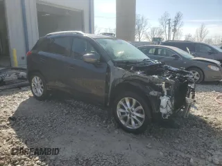 2015 Mazda CX-5 Grand Touring with VIN JM3KE4DY4F0457962, listed as a Copart auction lot 48061685 with 96,379 mi miles and Clean Title. Bid and sale history available at carsss.com. Image 4.