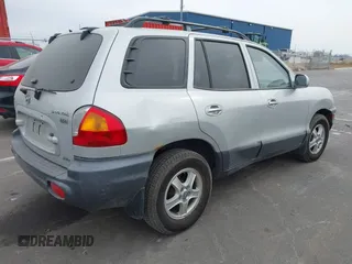 2003 Hyundai Santa Fe LX with VIN KM8SC73E83U568666, listed as a IAAI auction lot 41679044 with 127,560 mi miles. Bid and sale history available at carsss.com. Image 4.