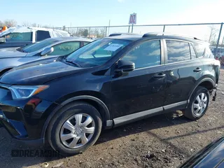 2018 Toyota RAV4 LE with VIN 2T3BFREV8JW706999, listed as a IAAI auction lot 41863485 with 115,589 mi miles. Bid and sale history available at carsss.com. Image 14.