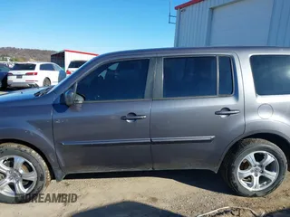 2015 Honda Pilot EX-L with VIN 5FNYF4H57FB063115, listed as a IAAI auction lot 41248234 with 187,752 mi miles and . Bid and sale history available at carsss.com. Image 14.