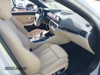 2019 BMW 3 Series 330i with VIN WBA5R1C55KAK12332, listed as a IAAI auction lot 41692035 with 13,657 mi miles and . Bid and sale history available at DreamBid. Image 5.