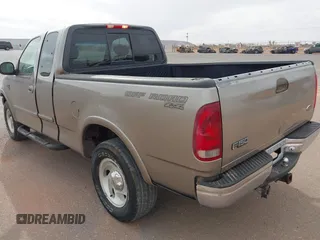 2001 Ford F-150 XL with VIN 2FTRX18L61CA36907, listed as a IAAI auction lot 41906933 with 317,857 mi miles. Bid and sale history available at carsss.com. Image 3.