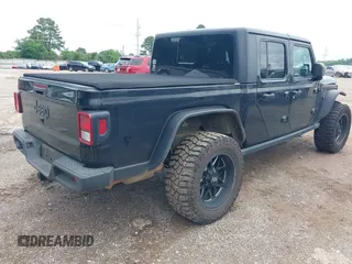 2021 Jeep Gladiator Sport S with VIN 1C6JJTAM7ML554412, listed as a IAAI auction lot 42199167 with 74,263 mi miles and . Bid and sale history available at DreamBid. Image 4.