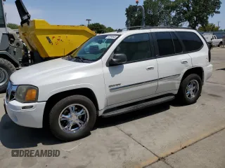 2006 GMC Envoy SLE z VIN 1GKDT13S762345183, wystawiony jako Copart lot #60096645 z przebiegiem 249 658 mil mil oraz Szkoda całkowita • Salvage title. Historia ofert i sprzedaży dostępna na DreamBid. Obrazek 1.