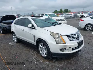 2015 Cadillac SRX Performance Collection with VIN 3GYFNFE35FS613177, listed as a IAAI auction lot 42102352 with Not provided miles and . Bid and sale history available at DreamBid. Image 1.
