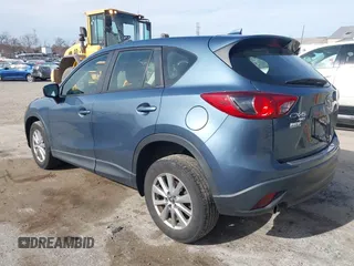2016 Mazda CX-5 Sport with VIN JM3KE4BY0G0746034, listed as a IAAI auction lot 41842894 with 92,801 mi miles. Bid and sale history available at carsss.com. Image 3.