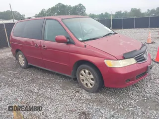 2003 Honda Odyssey EX-L with VIN 5FNRL18003B092984, listed as a IAAI auction lot 42439255 with 209,632 mi miles and . Bid and sale history available at DreamBid. Image 1.