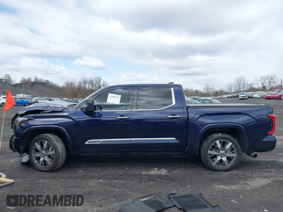 2022 Toyota Tundra Capstone Hybrid with VIN 5TFVC5DB5NX009829, listed as a IAAI auction lot 41983391 with 70,015 mi miles and . Bid and sale history available at DreamBid. Image 14.