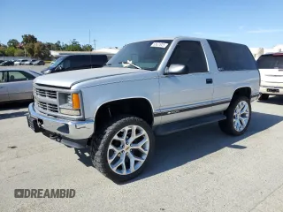 1997 Chevrolet Tahoe z VIN 3GNEK18R1VG112163, wystawiony jako Copart lot #58631925 z przebiegiem 213 262 mil mil oraz Tytuł czysty. Historia ofert i sprzedaży dostępna na DreamBid. Obrazek 1.