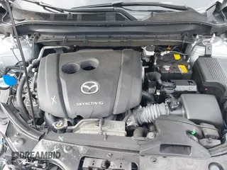 2021 Mazda CX-5 Touring with VIN JM3KFBCM9M1329806, listed as a IAAI auction lot 41825123 with 59,300 mi miles. Bid and sale history available at carsss.com. Image 10.