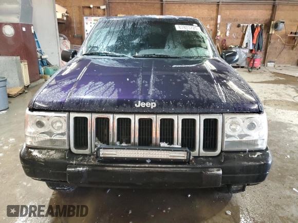 1997 Jeep Grand Cherokee Laredo with VIN 1J4GZ58Y7VC678708, listed as a Copart auction lot 87803725 with 312,585 mi miles and Salvage Title. Bid and sale history available at carsss.com. Image 5.