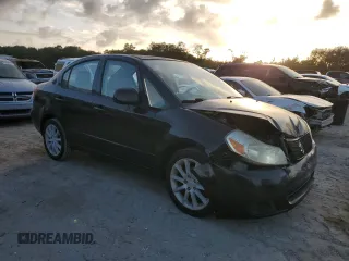 2011 Suzuki SX4 LE with VIN JS2YC5A29B6301704, listed as a Copart auction lot 79430574 with 173,287 mi miles and Salvage Title. Bid and sale history available at carsss.com. Image 4.