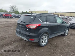 2015 Ford Escape SE with VIN 1FMCU9GX5FUB99018, listed as a IAAI auction lot 42250840 with 126,850 mi miles and . Bid and sale history available at DreamBid. Image 4.