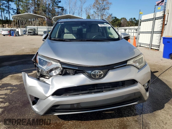 2018 Toyota RAV4 XLE with VIN JTMWFREV1JJ205906, listed as a Copart auction lot 84700564 with 64,953 mi miles and Salvage Title. Bid and sale history available at DreamBid. Image 5.