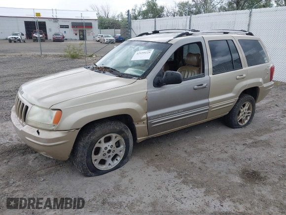 1999 Jeep Grand Cherokee Limited with VIN 1J4GW68SXXC664055, listed as a IAAI auction lot 42339125 with 219,792 mi miles and . Bid and sale history available at DreamBid. Image 2.