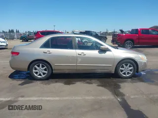 2003 Honda Accord EX z VIN 1HGCM66523A023920, wystawiony jako IAAI lot #42339108 z przebiegiem 165 553 mil mil oraz . Historia ofert i sprzedaży dostępna na DreamBid. Obrazek 13.