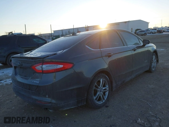 2015 Ford Fusion SE Hybrid with VIN 3FA6P0LU1FR219908, listed as a IAAI auction lot 41272688 with 310,452 mi miles. Bid and sale history available at carsss.com. Image 4.