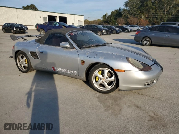 1998 Porsche Boxster с VIN WP0CA2987WS620369, выставлен на аукционе Copart как лот 81003964 с пробегом Не указан миль и Списание • Salvage title. История ставок и продаж доступна на DreamBid. Изображение 4.