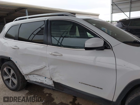 2019 Jeep Cherokee Limited with VIN 1C4PJMDX1KD197833, listed as a IAAI auction lot 42027945 with 153,053 mi miles and . Bid and sale history available at DreamBid. Image 13.