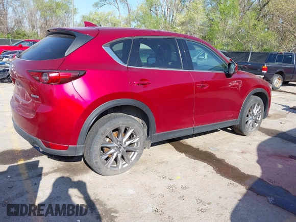 2021 Mazda CX-5 Grand Touring with VIN JM3KFBDM8M1390188, listed as a IAAI auction lot 42000444 with 84,908 mi miles. Bid and sale history available at carsss.com. Image 4.